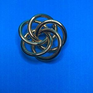 Swirl gold tone brooch
